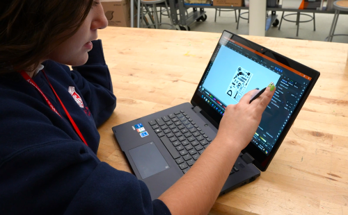A student using an ASUS laptop